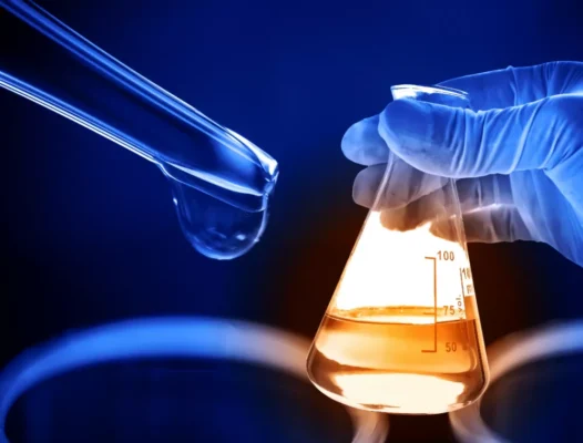 Image of a researcher holding a vial of high-quality research chemicals purchased online from Rcchemsupply.net